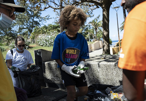 A young volunteer sorts trash in Saint-Pierre, Reunion Island, France, Sept. 18, 2021.Bastien Doudaine/Bastien Doudaine / Hans Lucas